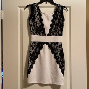 White mini dress with black lace overlay
